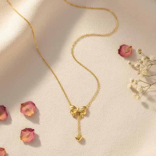 Gold Bow Heart Necklace - Flat Lay Style